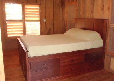 Bedroom 2. Queen bed with under bed storage.