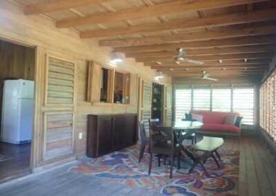 Dining with louvered indoor/outdoor space. Pass-through to kitchen
